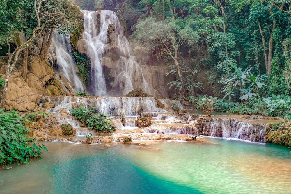 Kuang Si Falls with its characteristic blue waters